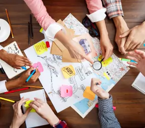 Colorful balloons and streamers decorating an empty office meeting room.